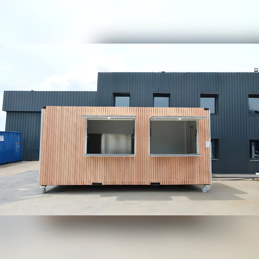 Bungalow modulaire Eurocontex – façade bardage bois avec grandes fenêtres coulissantes sur roulettes
